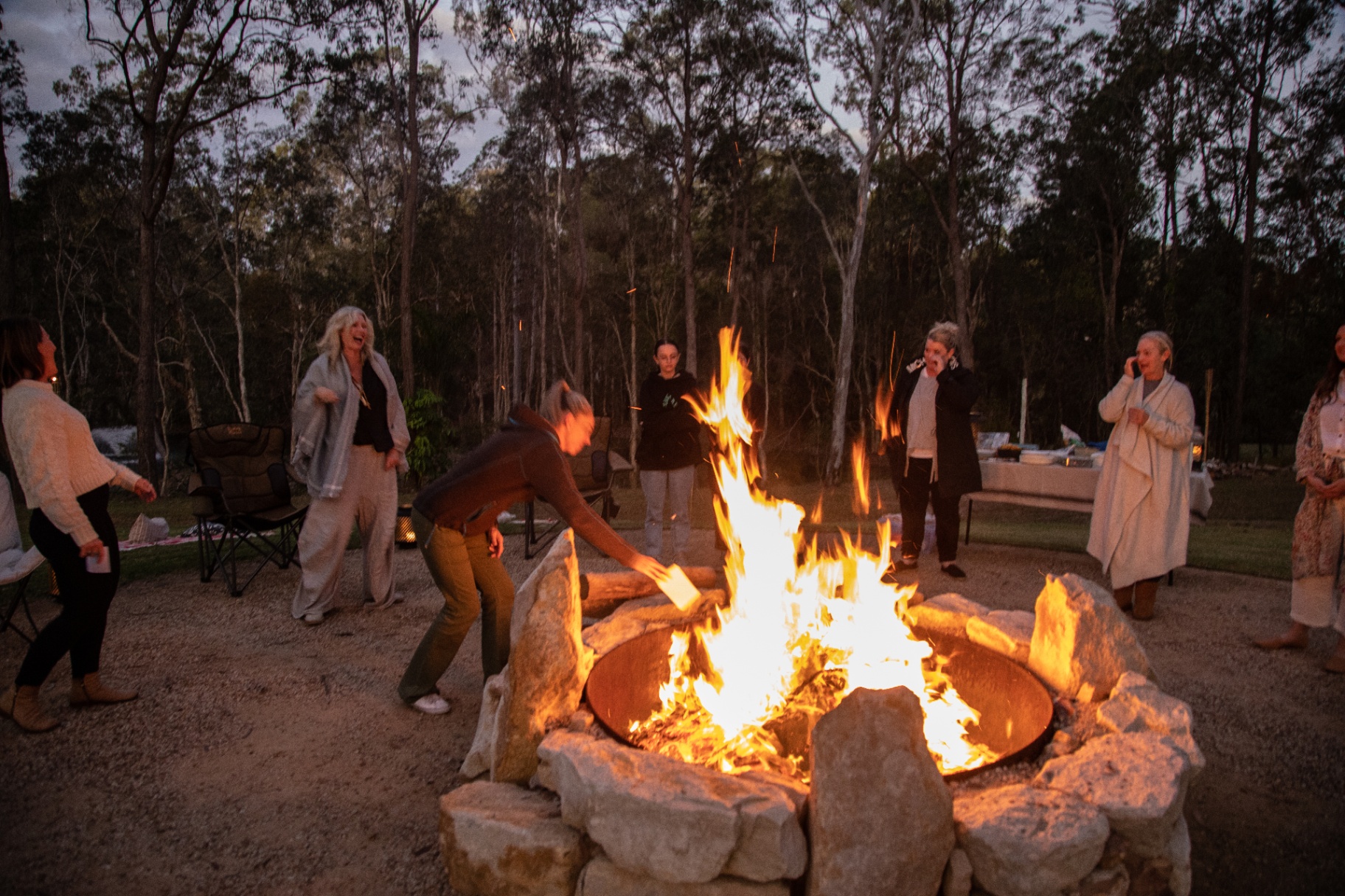 Tending the sacred fire at dusk