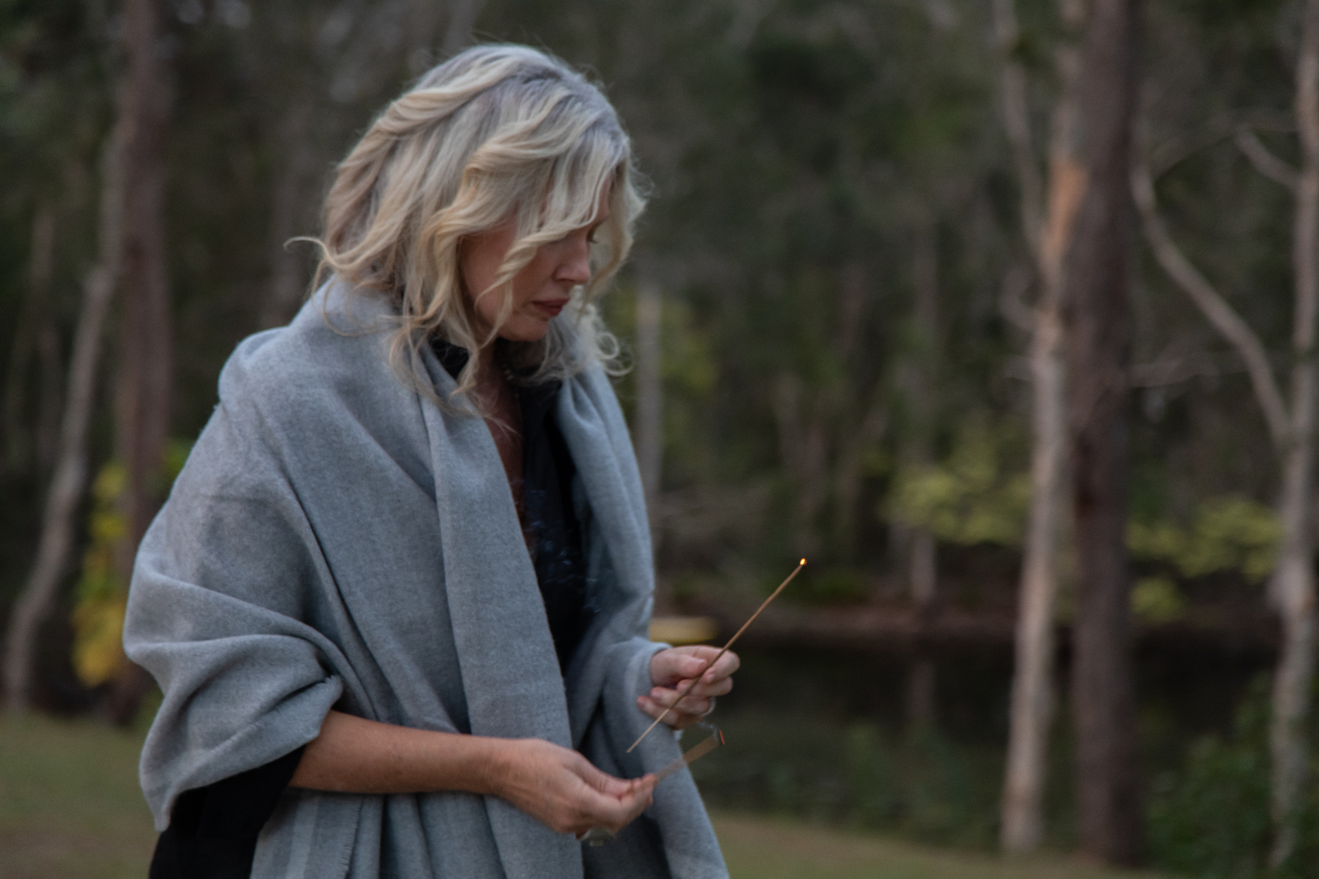Kim lighting incense to open the gathering