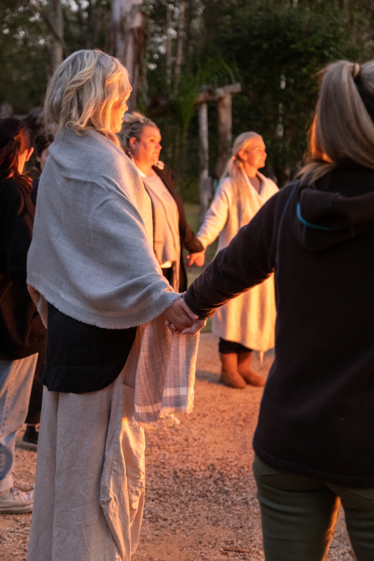 Joined hands in the golden hour light